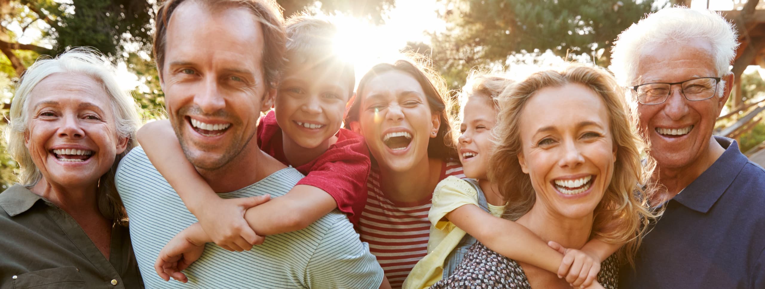 A Lynchburg family smiling, the Hill City community on Thomson Drive