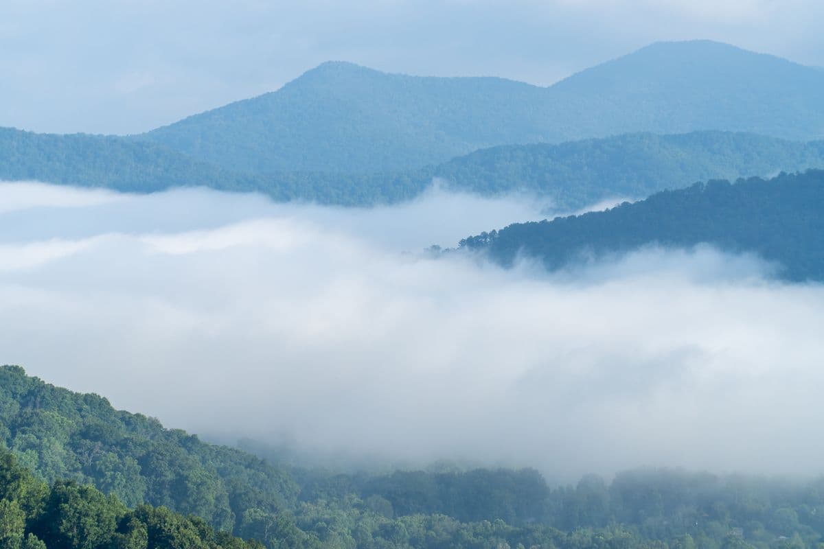 Misty blue mountain ridgelines fading into the distance
