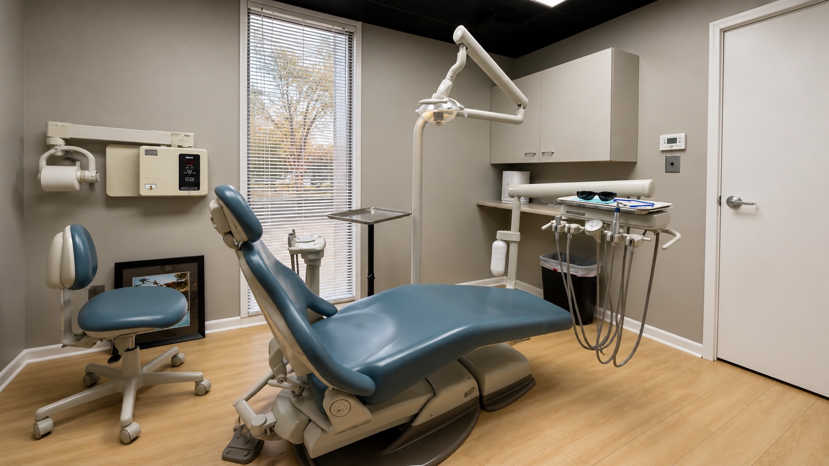 A treatment room with the patient chair and modern equipment