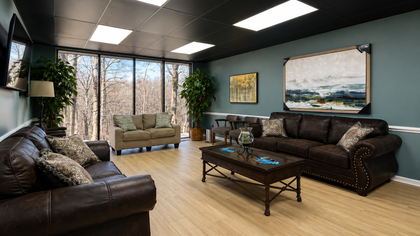 Second waiting lounge with leather sofas and Lynchburg art
